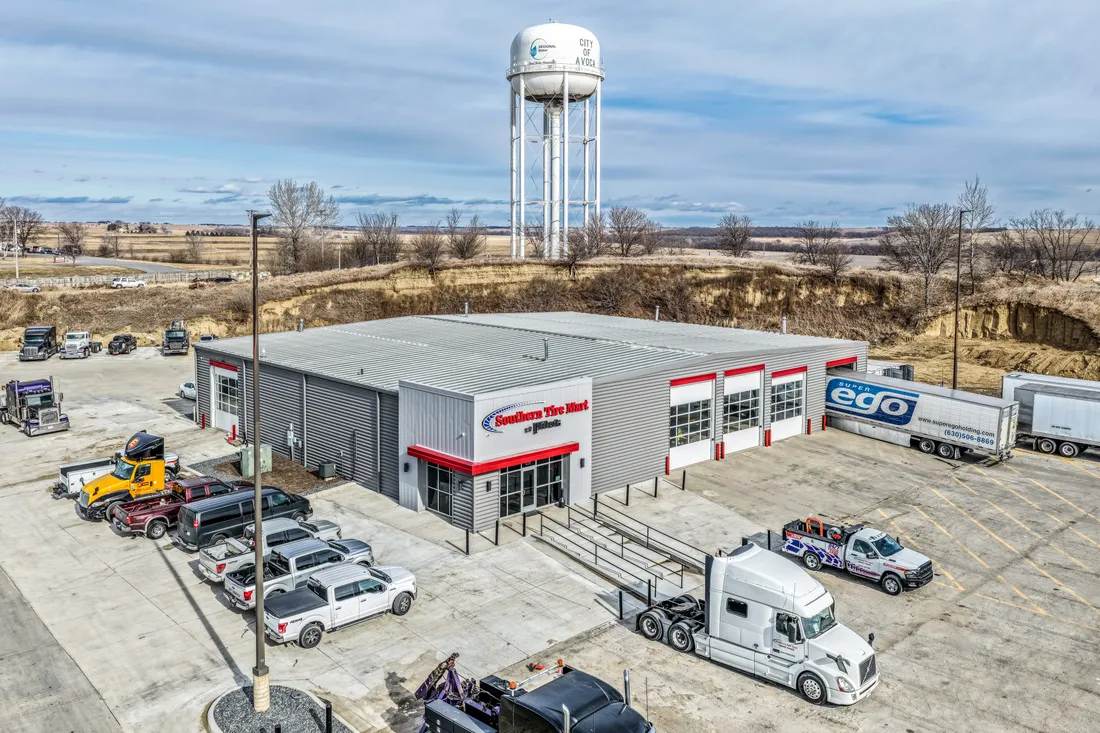 Aerial view of the Southern Tire Mart commercial facility with a water tower behind it